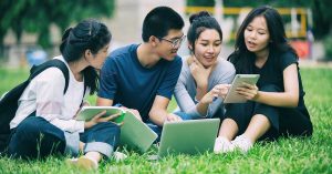 4 Asian students discussing